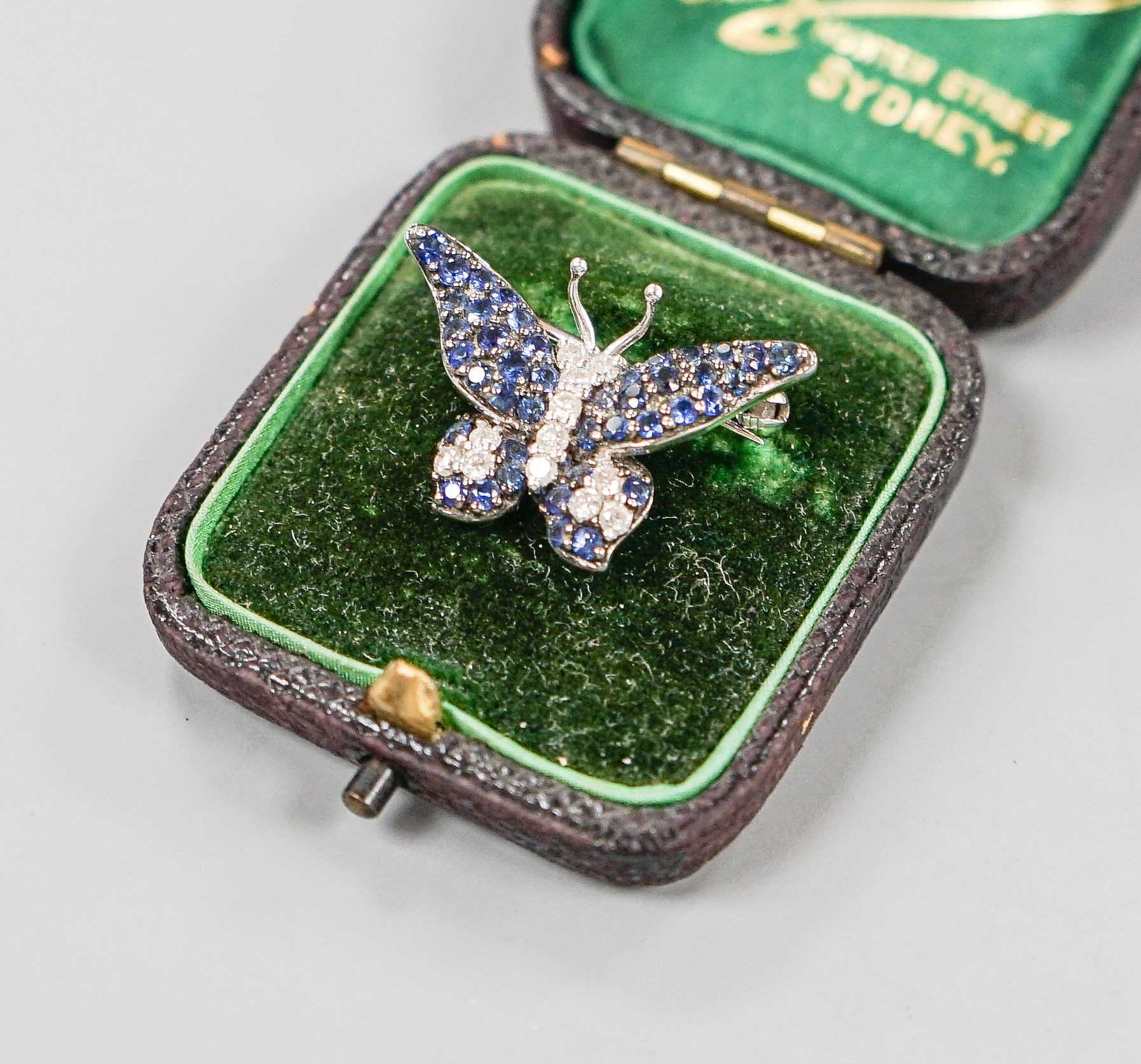 A modern 18ctwhite gold, pave set sapphire and diamond set butterfly brooch, 25mm, gross weight 4.5 grams.